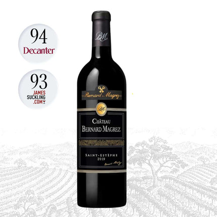 A bottle of Château Bernard Mâgry Saint-Étienne 2019 red wine centered on a white background with vineyard artwork at the bottom. Two circular rating badges on the left read 94 Decanter and 93 James Suckling Com, and a 'Winery Highlights' logo appears on the right.