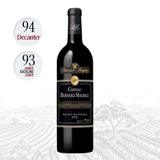 A bottle of Château Bernard Mâgry Saint-Étienne 2019 red wine centered on a white background with vineyard artwork at the bottom. Two circular rating badges on the left read 94 Decanter and 93 James Suckling Com, and a 'Winery Highlights' logo appears on the right.