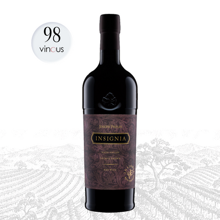 A bottle of Joseph Pérignon Insignia Red Wine shown on a white background with a faint vineyard illustration. Two promotional badges appear at the top: a white circle reading '98 vinous' and a black-and-beige box reading 'WINE OF THE MONTH'.