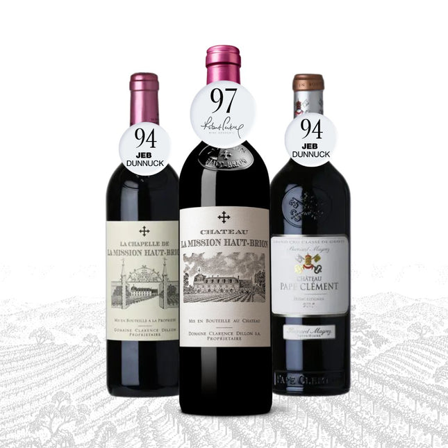 Three wine bottles with labels indicating ratings from Jeb Dunnuck on a white background