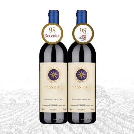 Two bottles of Sassicaia wine with award stickers on a white background